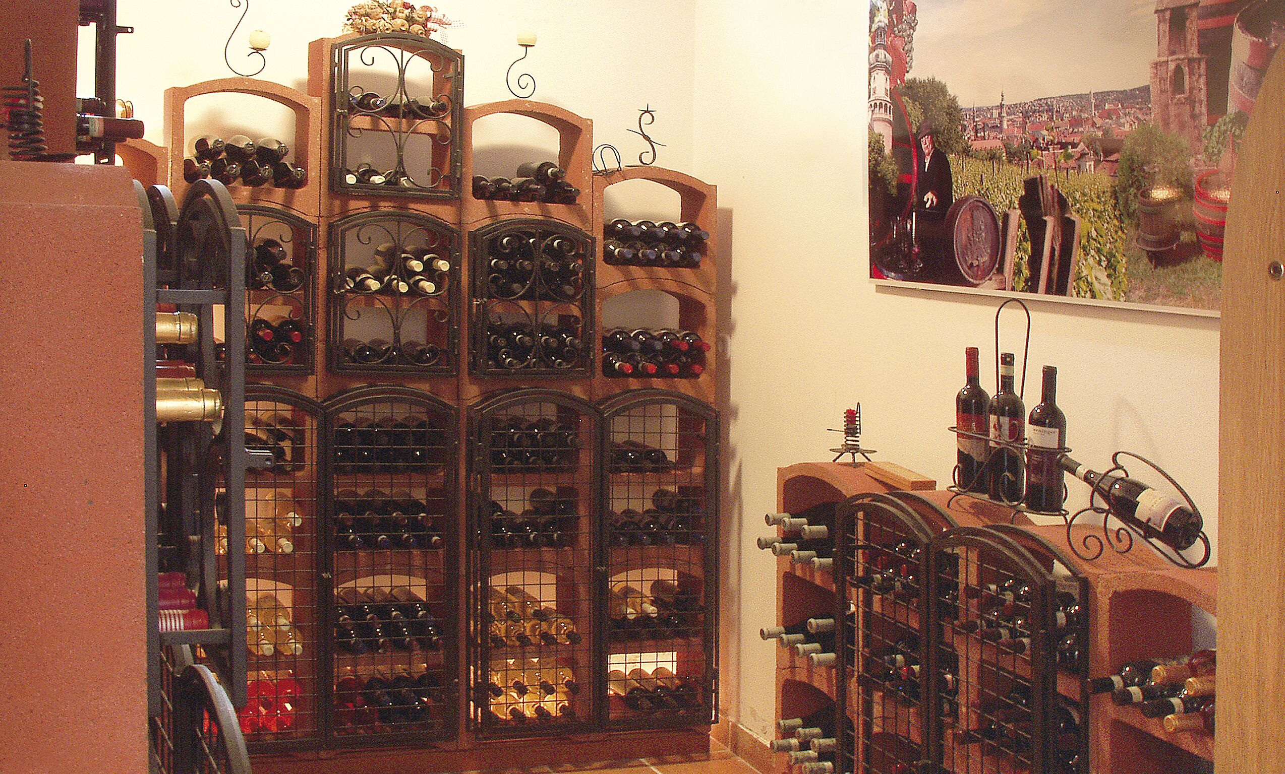A wine cellar with multiple wooden wine racks filled with bottles.
