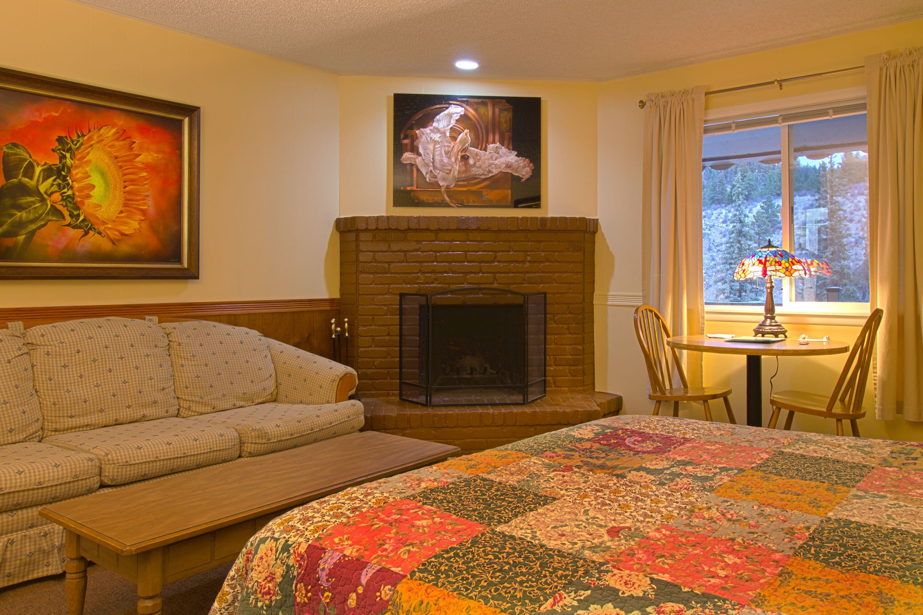 basic suite #11 | living area | 40-inch flat-screen tv with satellite channels, tv