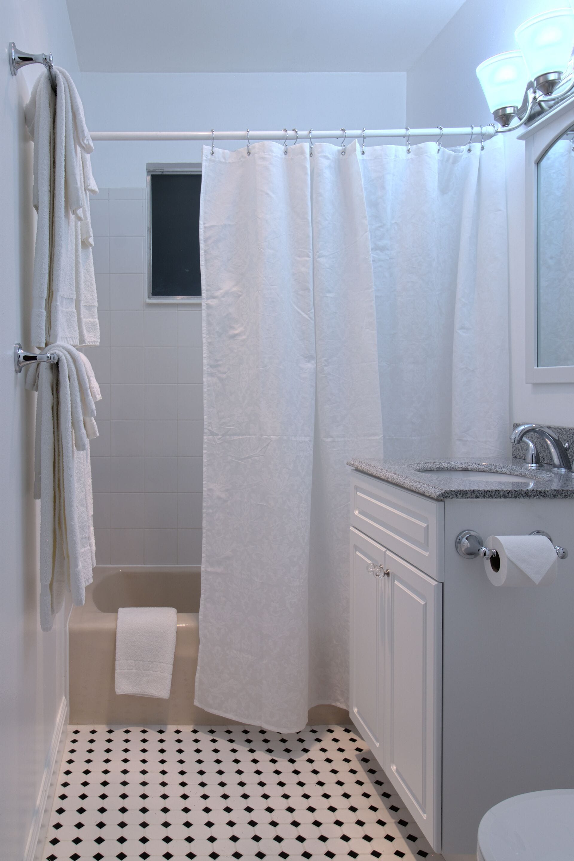 basic suite #11 | bathroom | combined shower/bathtub, free toiletries, hair dryer, towels
