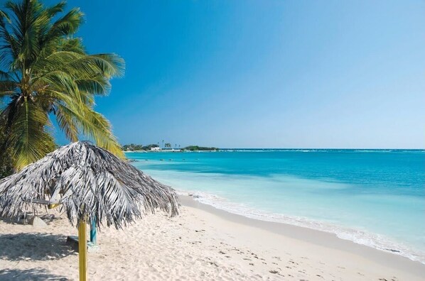 On the beach, sun loungers, beach towels