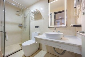 A modern bathroom with a glass-enclosed shower, a white toilet, a marble sink, and a large mirror. - 7 Days Inn (Ningguo Ningcheng North Road) (Xuancheng)