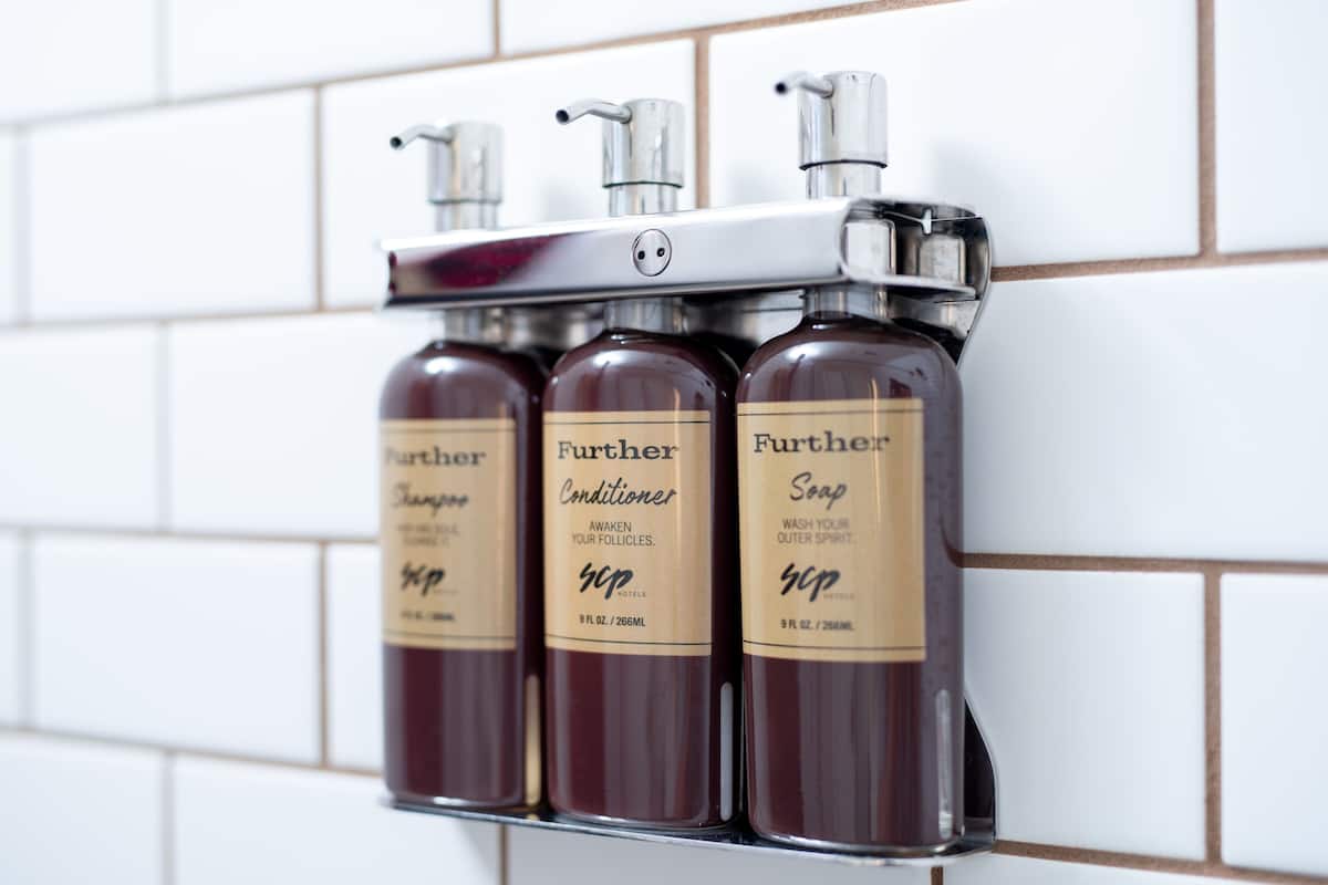 combined shower/bathtub, designer toiletries, hair dryer, towels