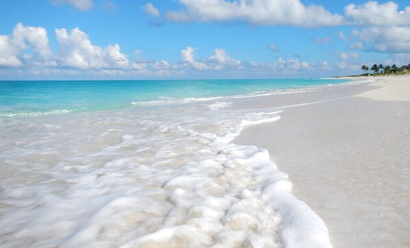 On the beach, sun-loungers, beach towels