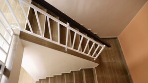 A staircase with a white handrail and beige steps. - City of the Sun Newly renovated loving house (Nairobi)
