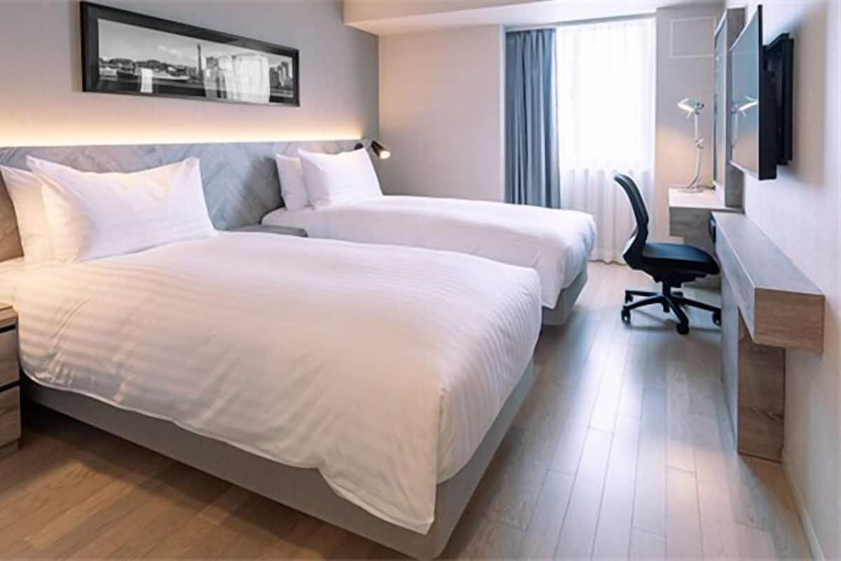 Premium bedding, down duvets, in-room safe, desk