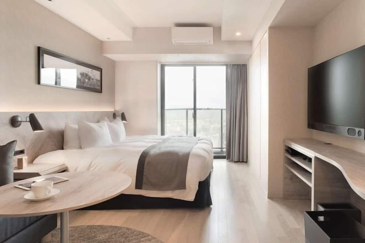 Premium bedding, down duvets, in-room safe, desk