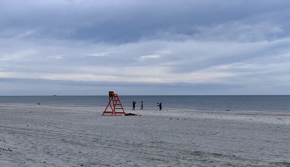 On the beach, sun loungers, beach towels