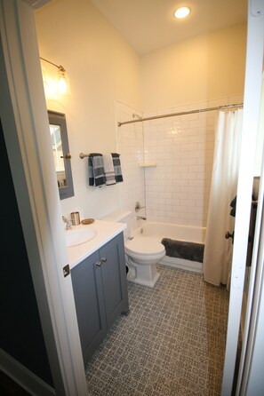 Combined shower/tub, hair dryer, towels, soap - Higbee House, your home away from home and then some. (Memphis)