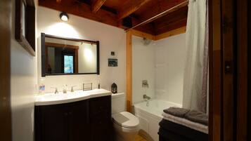 Combined shower/bathtub, hair dryer, towels, soap