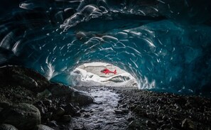 An ice cave with a red helicopter in the center. - Private Chalet - Relax and unwind or recreate to your heart's content (Mount Currie)