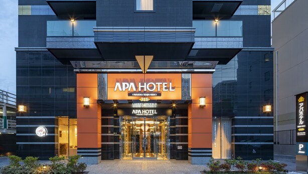 A modern hotel entrance with a prominent sign reading "APA HOTEL". - APA Hotel Fukuoka Tenjin Nishi (Fukuoka)