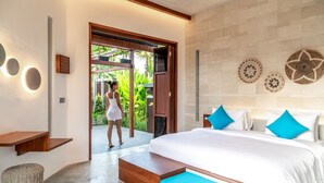 A modern bedroom with a large bed, a wooden bench, and a small stool. - Podpadi Design Spaces (Ubud)