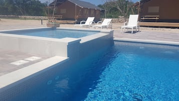 Seasonal outdoor pool, free pool cabanas, pool umbrellas