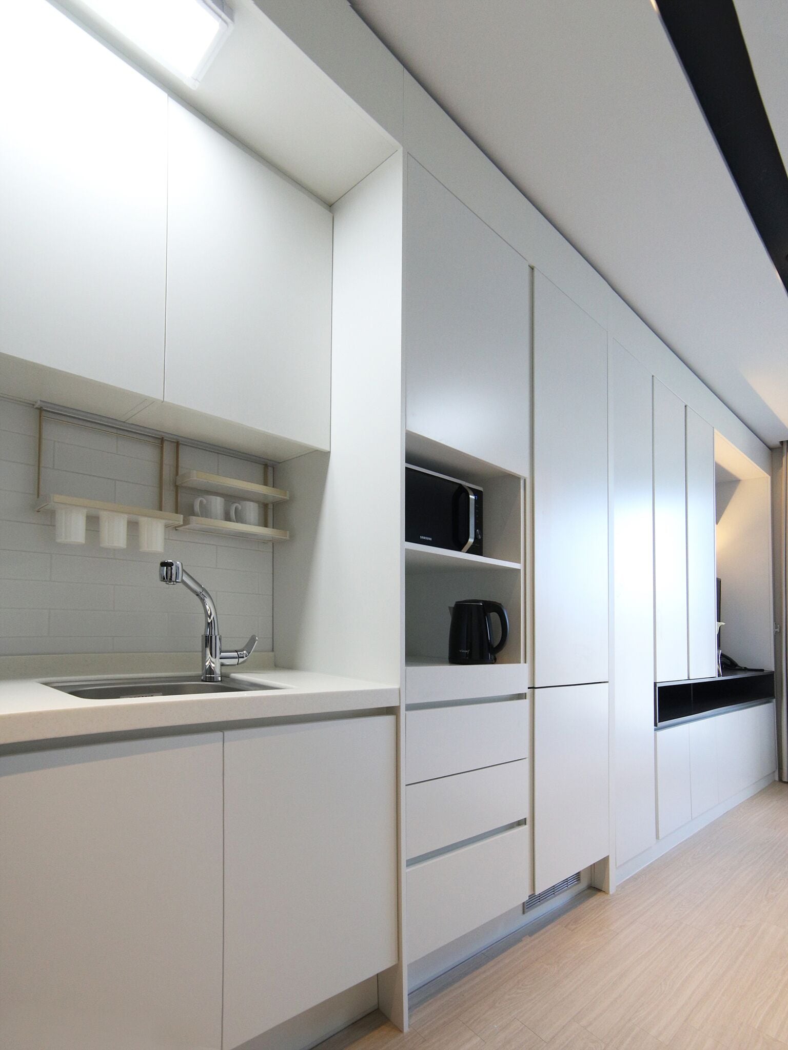 full-sized fridge, microwave, espresso maker, coffee/tea maker