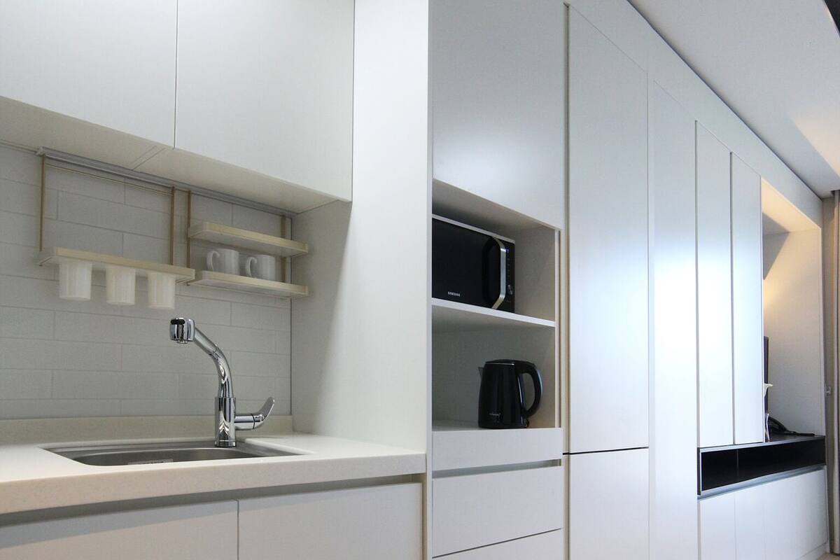 full-sized fridge, microwave, espresso maker, coffee/tea maker