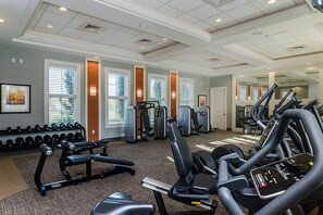A gym with treadmills, elliptical machines, and free weights. - Ev8094ha - Solterra Resort - 5 Bed 5 Baths Villa (Davenport)