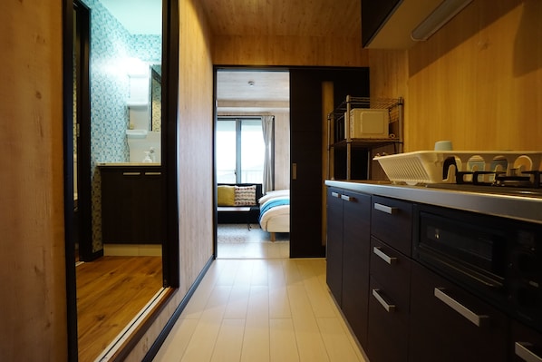 Apartment | Private kitchenette | Fridge, microwave, stovetop, electric kettle - Terry's Apartment Namba South VI AD04A (Osaka)