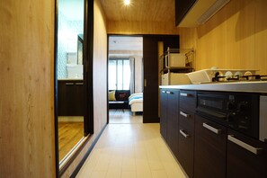 Apartment | Private kitchenette | Fridge, microwave, stovetop, electric kettle - Terry's Apartment Namba South VI AD05A (Osaka)