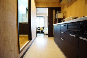 Apartment | Private kitchenette | Fridge, microwave, stovetop, electric kettle - Terry's Apartment Namba South VI AD06A (Osaka)