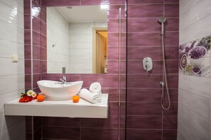 Shower, hair dryer, towels, toilet paper