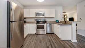 Stovetop, dishwasher, cookware/dishes/utensils - Aco8054ha - Club Cortile - 3 Bed 2 Baths Apartment (Kissimmee)