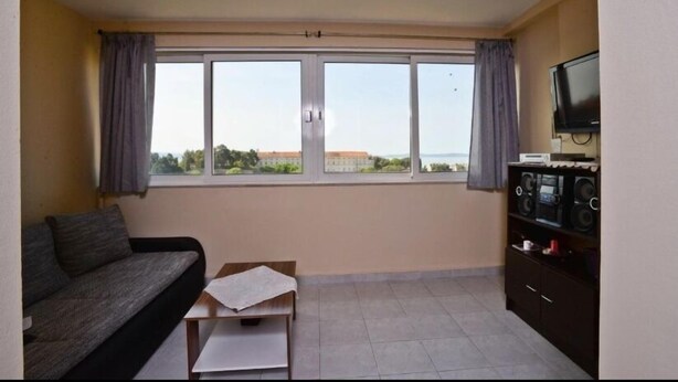 Appartamento, 2 camere da letto | Area soggiorno | TV a schermo piatto