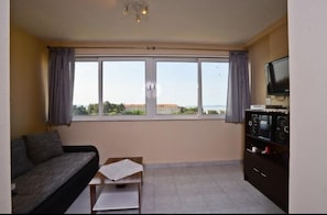 Apartment, 2 Bedrooms | Living area | Flat-screen TV