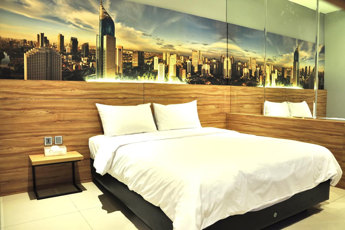 A modern bedroom with a cityscape mural, a wooden headboard, and a neatly made bed.