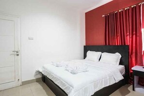 Habitación Deluxe | Escritorio, wifi gratis y ropa de cama 