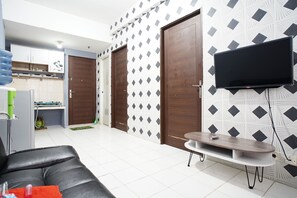Room | Living room | 24-inch flat-screen TV with satellite channels, TV - City Park Apartment by Anita (Jakarta)