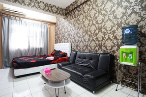 Studio | Living area | 24-inch flat-screen TV with satellite channels, TV - City Park Apartment by Anita (Jakarta)