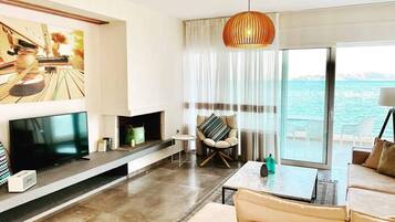 Luxury Suite, Sea View (Tyche) | Living area | 42-inch Smart TV with digital channels, TV