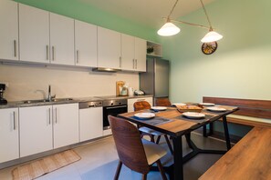 Apartment, 3 Bedrooms | Private kitchen | Full-sized fridge, oven, stovetop, coffee/tea maker