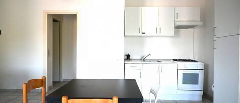 Fridge, oven, dining tables