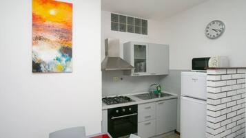 Fridge, oven, dining tables