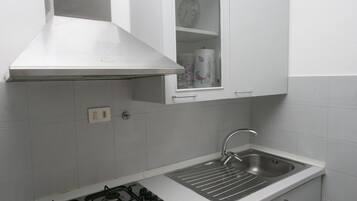 Fridge, oven, dining tables