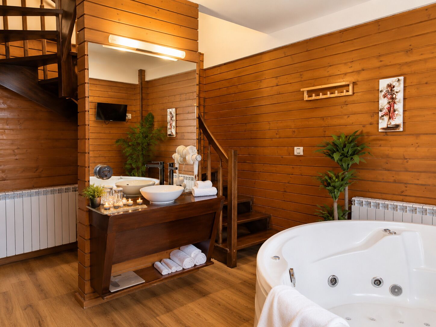 Un interior de madera con un tocador de baño, una bañera y una escalera.