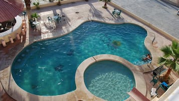 Outdoor pool, open 8:00 AM to 10:00 PM, free cabanas, pool umbrellas