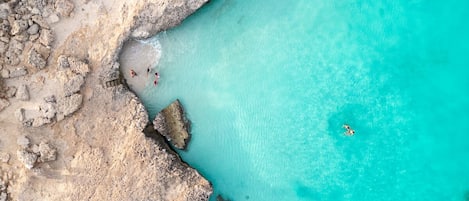 On the beach, sun-loungers, beach towels