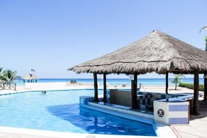 Relax by the oceanfront pool surrounded by a deck and gazebo.