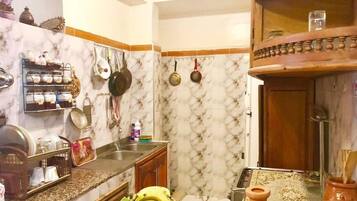 Apartment, 1 Bedroom | Private kitchen | Full-sized fridge, stovetop, cookware/dishes/utensils