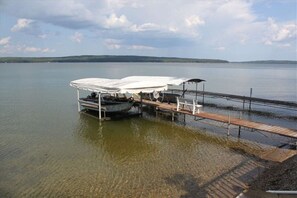 Enjoy serene lake views and stable docking for your boat.