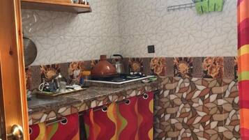 Apartment, 1 Bedroom | Private kitchen | Full-size fridge, stovetop, cookware/dishes/utensils