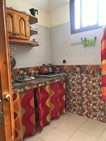 Apartment, 1 Bedroom | Private kitchen | Full-size fridge, stovetop, cookware/dishes/utensils