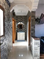 Apartment, 1 Bedroom | Living area | 32-inch flat-screen TV with satellite channels, TV