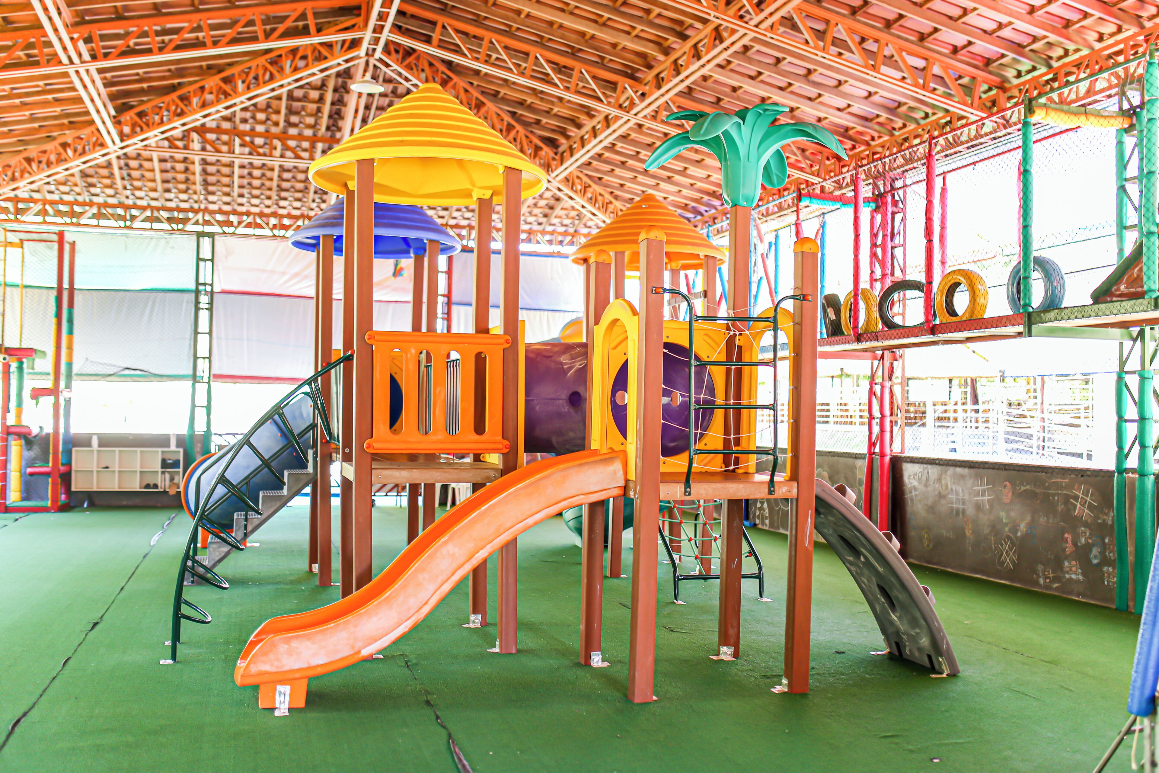 A playground with slides and climbing structures.