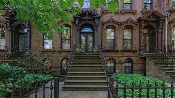A historic building with a grand entrance, multiple windows, and a central staircase leading to the main door. - beautiful brownstone (New Haven)