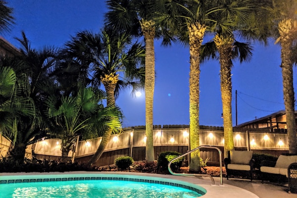 Your private oasis is just one block from the beach!