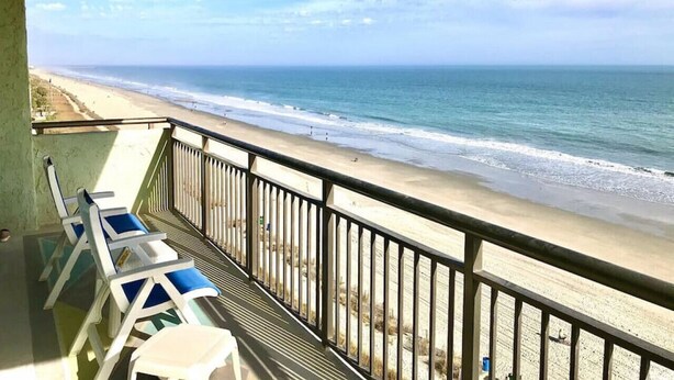 A balcony with a view of the beach and ocean. - OceanFront Condo with Dolphin Views - 2bd/2ba Myrtle Beach 11801 (Myrtle Beach)