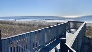 A wooden boardwalk leading to a beach with a clear view of the ocean. - OceanFront Condo with Dolphin Views - 2bd/2ba Myrtle Beach 11801 (Myrtle Beach)